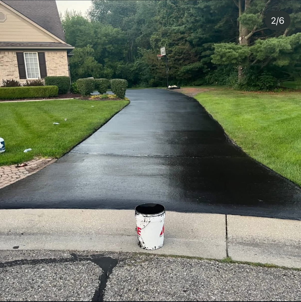 Glossy black sealcoated residential driveway